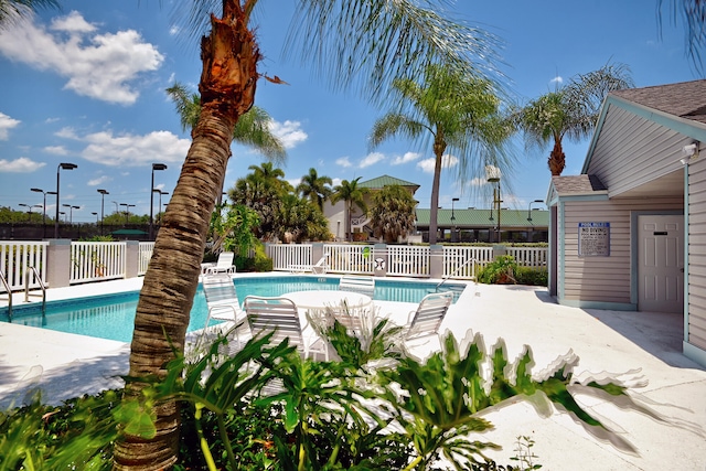 view of swimming pool featuring a patio area