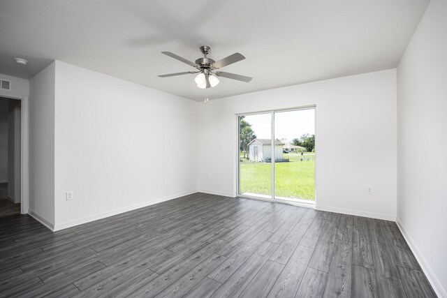 unfurnished room with ceiling fan and dark hardwood / wood-style floors