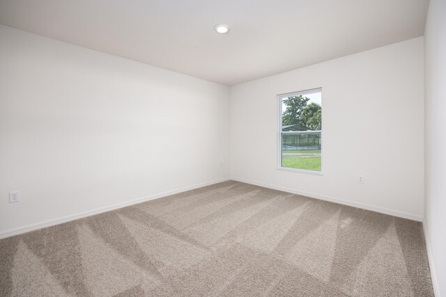 unfurnished room featuring carpet flooring