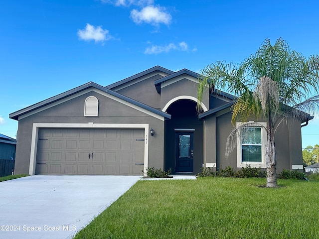 ranch-style home with a front lawn and a garage