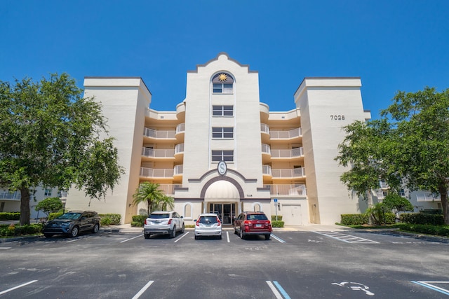 view of property with uncovered parking