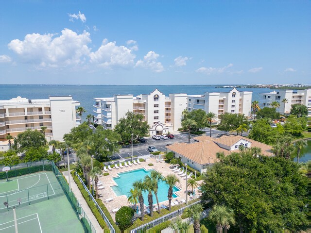 birds eye view of property with a water view