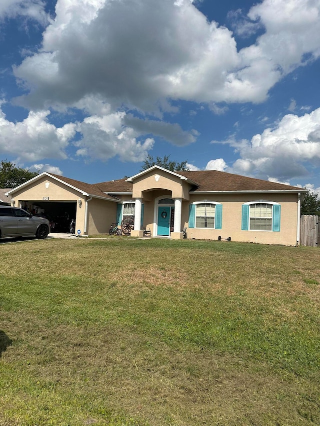 ranch-style home with a front lawn