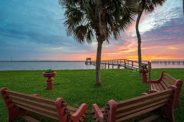 yard at dusk with a water view