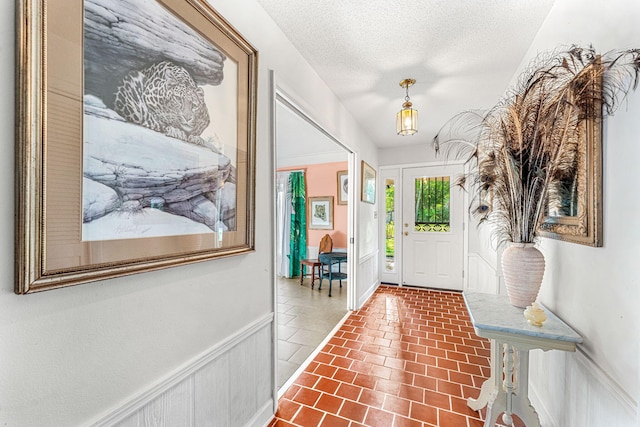 entrance foyer featuring a textured ceiling