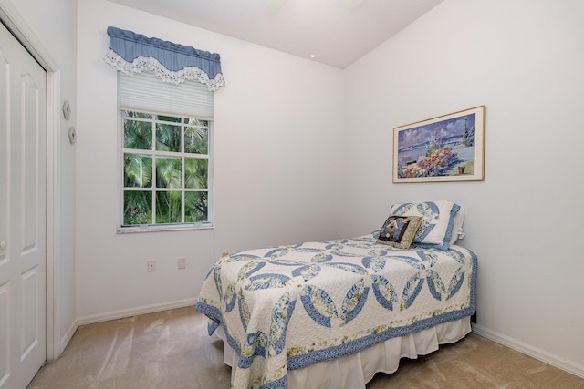 bedroom featuring carpet floors, a closet, and ceiling fan