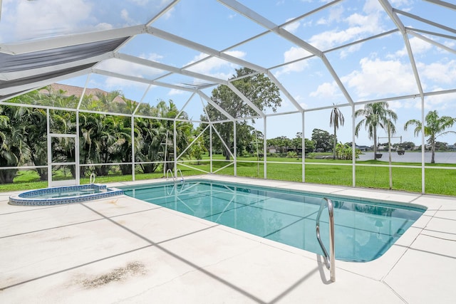 view of pool with a lanai, a patio area, and a yard