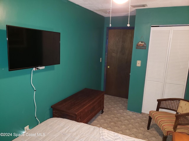 bedroom featuring light carpet