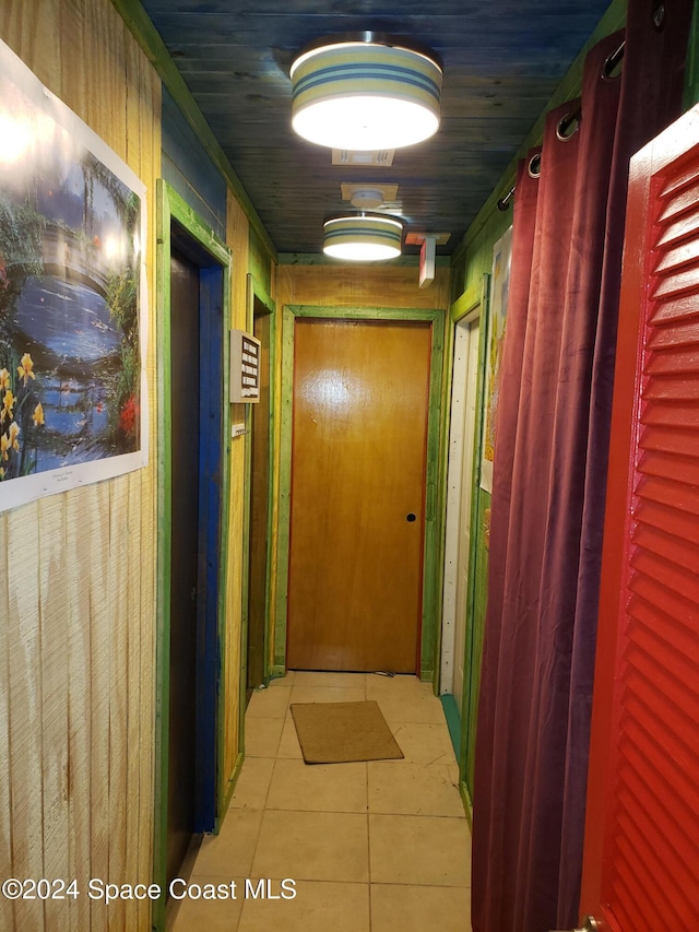 corridor with light tile patterned floors