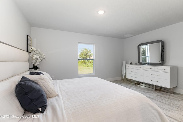 bedroom with light hardwood / wood-style floors