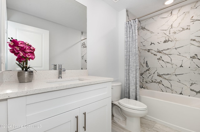 full bathroom featuring vanity, toilet, and shower / bath combo with shower curtain