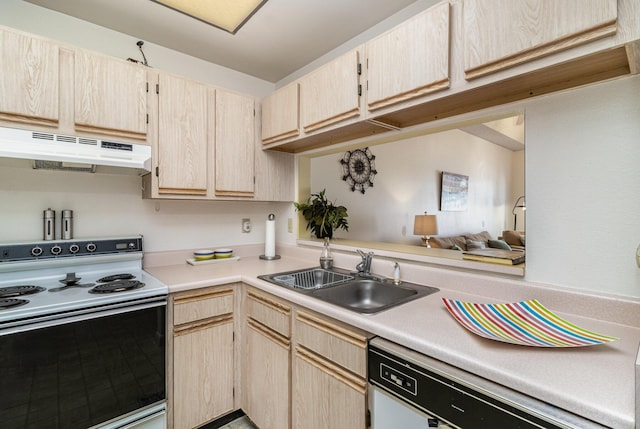 kitchen featuring light brown cabinetry, sink, and white appliances