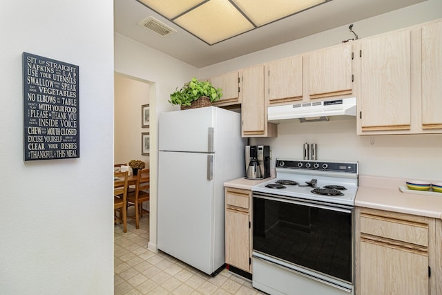 kitchen featuring light brown cabinetry and white appliances