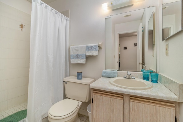 bathroom with vanity, toilet, and walk in shower