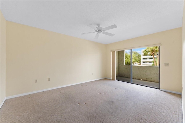 unfurnished room with ceiling fan and light colored carpet