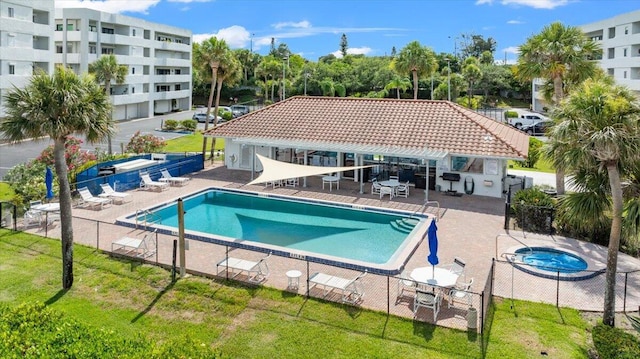 view of swimming pool with a patio area