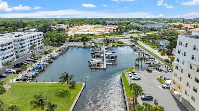 birds eye view of property with a water view