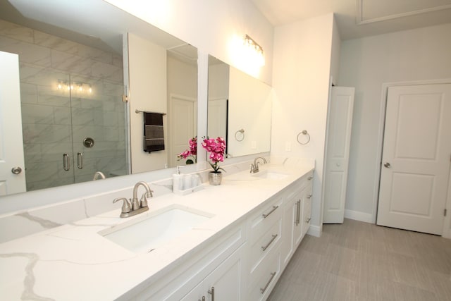 bathroom featuring vanity and an enclosed shower