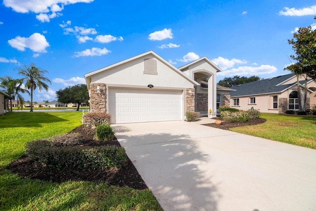 view of front of house featuring a garage and a front lawn