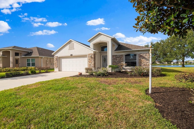 view of front of house featuring a garage and a front lawn