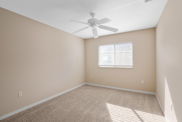 unfurnished room featuring ceiling fan and carpet floors