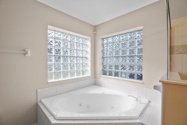 bathroom featuring tiled bath