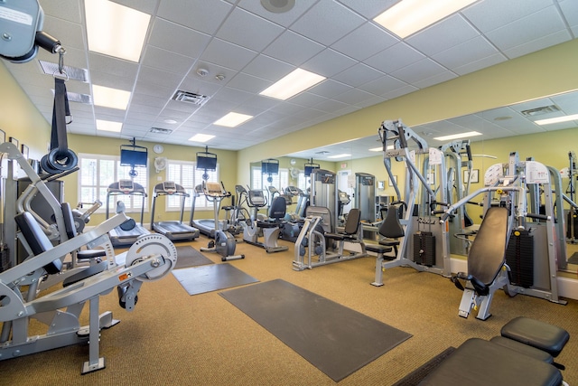 workout area featuring a paneled ceiling