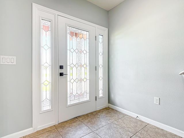 entryway featuring light tile patterned floors