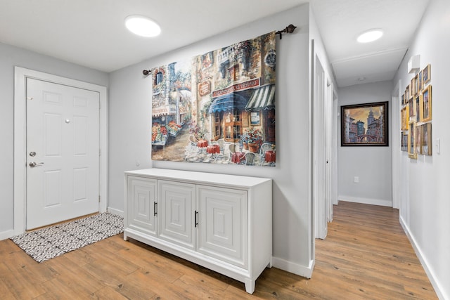 hallway with light wood-type flooring