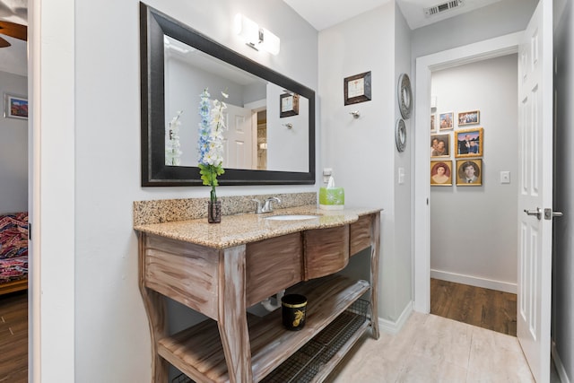 bathroom featuring vanity and wood-type flooring