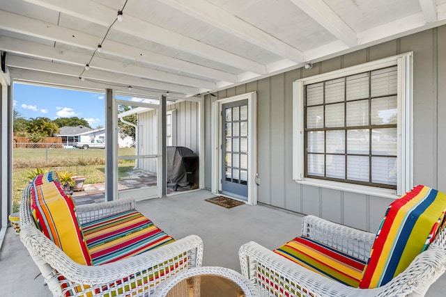 sunroom with beam ceiling