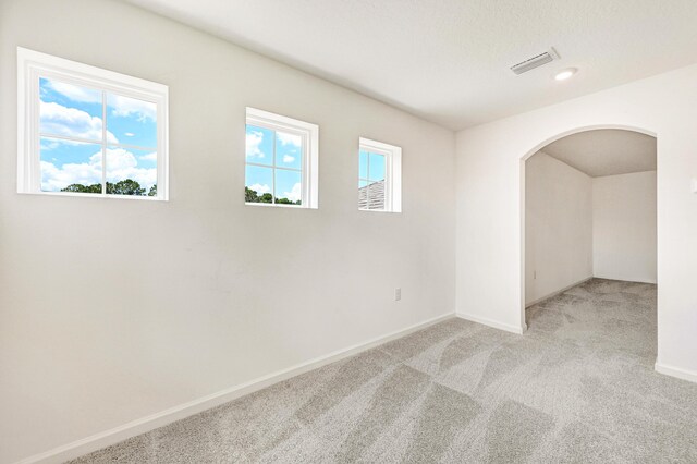 empty room with light colored carpet