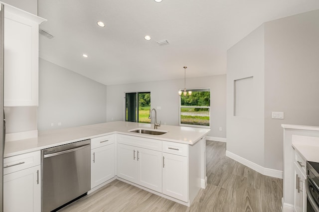 kitchen with dishwasher, kitchen peninsula, white cabinetry, and sink