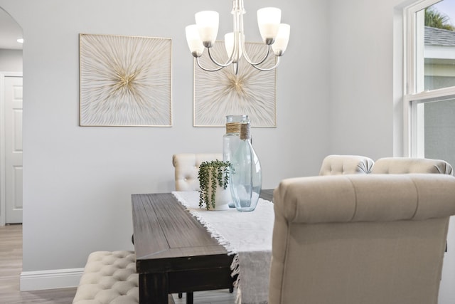 interior space with a chandelier and light hardwood / wood-style floors