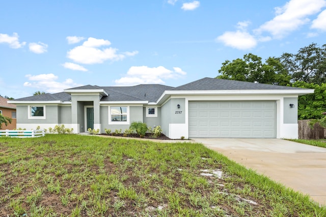 ranch-style home featuring a front yard and a garage