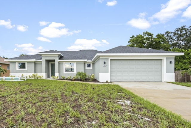 single story home featuring a garage and a front yard