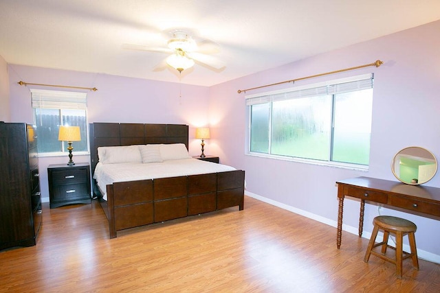 bedroom featuring ceiling fan and light hardwood / wood-style flooring