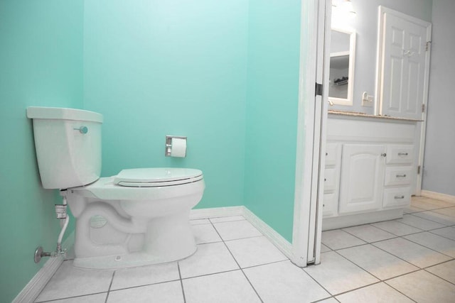 bathroom with tile patterned floors, vanity, and toilet