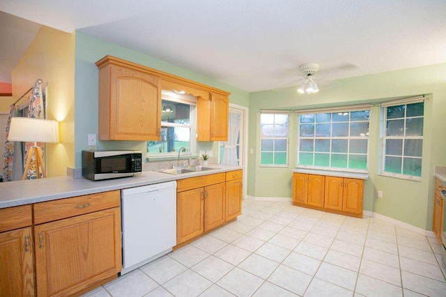 kitchen with ceiling fan, dishwasher, light tile patterned flooring, and sink