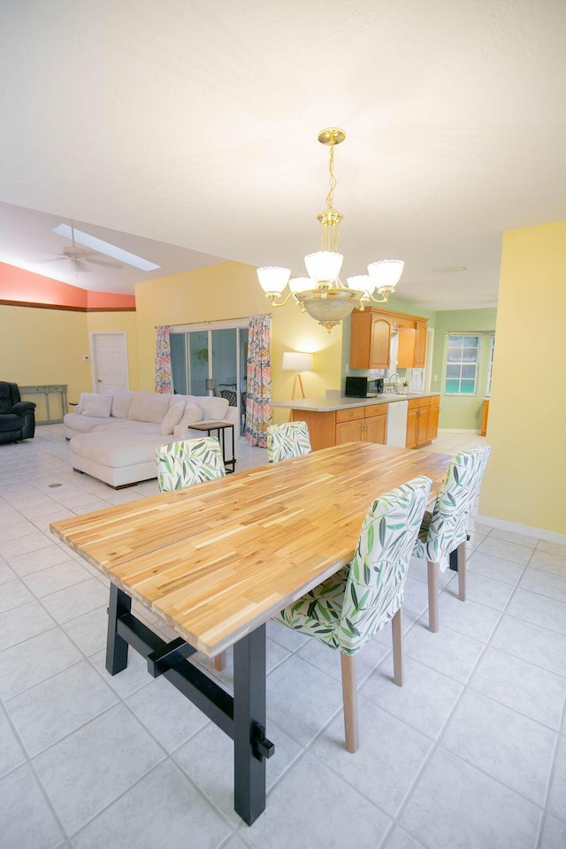 tiled dining area with a notable chandelier