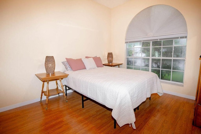 bedroom featuring hardwood / wood-style floors