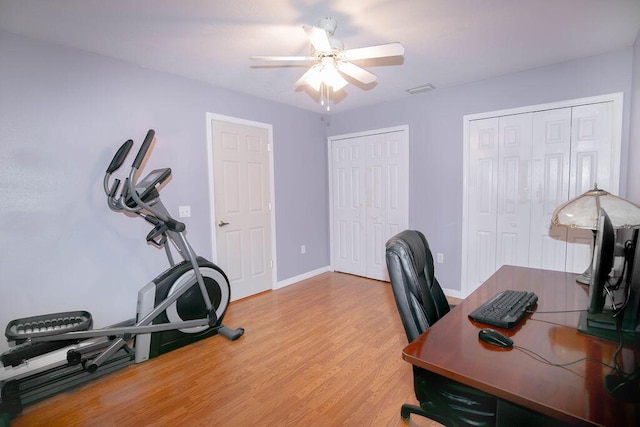 office space with hardwood / wood-style floors and ceiling fan