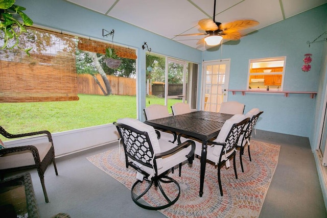 sunroom / solarium featuring ceiling fan