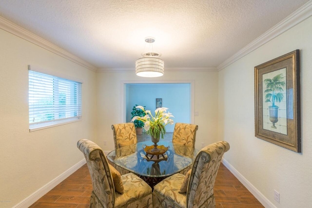 dining space featuring crown molding and a textured ceiling