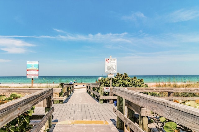 property view of water featuring a beach view