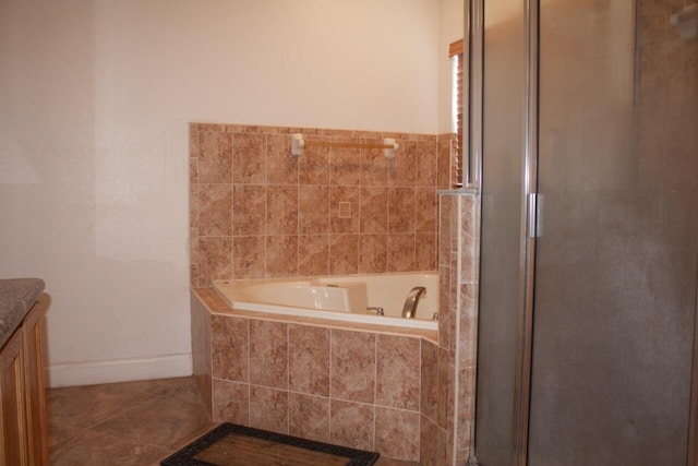 bathroom featuring tile patterned floors, separate shower and tub, and vanity