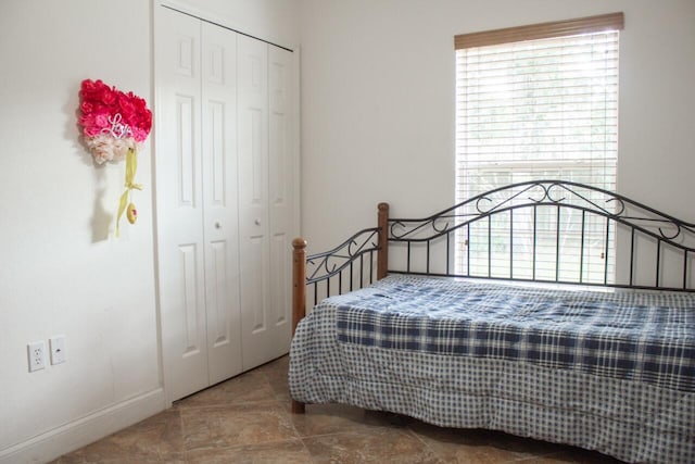 bedroom featuring a closet and tile patterned floors