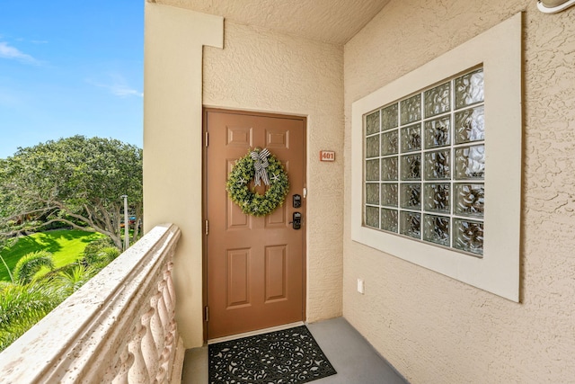 doorway to property featuring a balcony