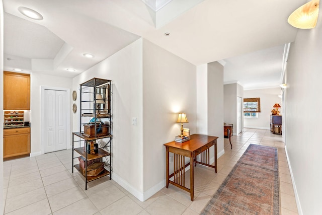 hallway with light tile patterned floors