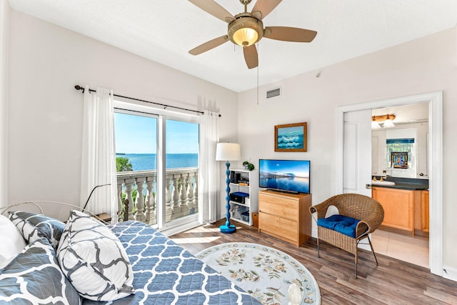 bedroom with access to outside, ceiling fan, and hardwood / wood-style flooring